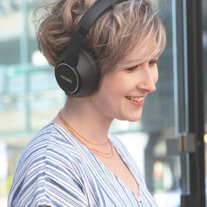 Woman wearing Koss BT740i QZ Wireless Noise Cancelling Headphones