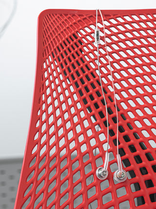 Koss CL3i Earbuds hung over the back of a chair