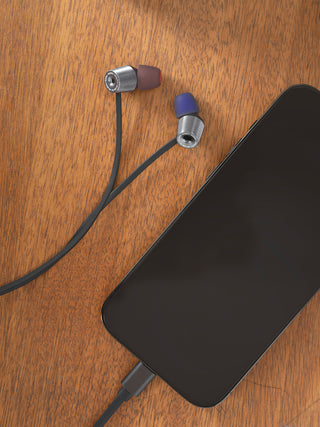 KEB90 earbud headphones plugged into iphone.