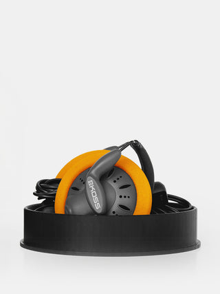 In-ear headphones with orange ear cups and black accents on a white background