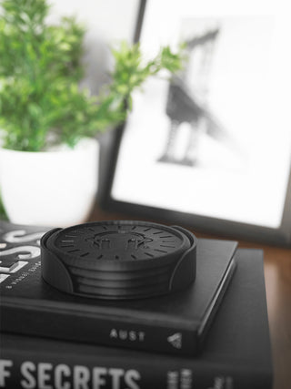 Black circular object on a book with a blurred background