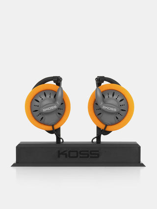 Pair of Koss headphones on a stand with a white background