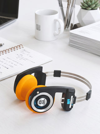 Porta Pro Wireless with orange cushions on a white desk
