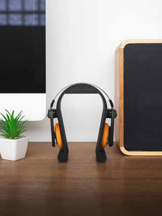 Wireless Porta Pro's resting on new 3D printed Koss Porta Pro stand on top of desk.