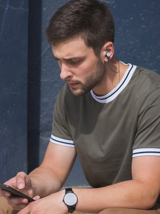 Man wearing BT115i-Wireless-Bluetooth-Ear-Buds