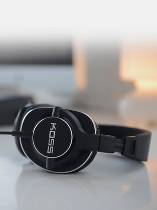 Koss Pro4S Full Size Studio Headphones, Black with Silver Trim 12 Koss Pro4S Studio Over Ear Headphones laying on a white table